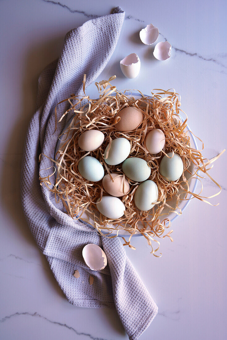 Free-range Araucana chicken eggs, including blue and green colours, flatlay