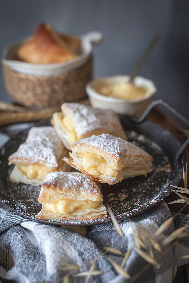 Vanilla cream puff pastries on a grey background