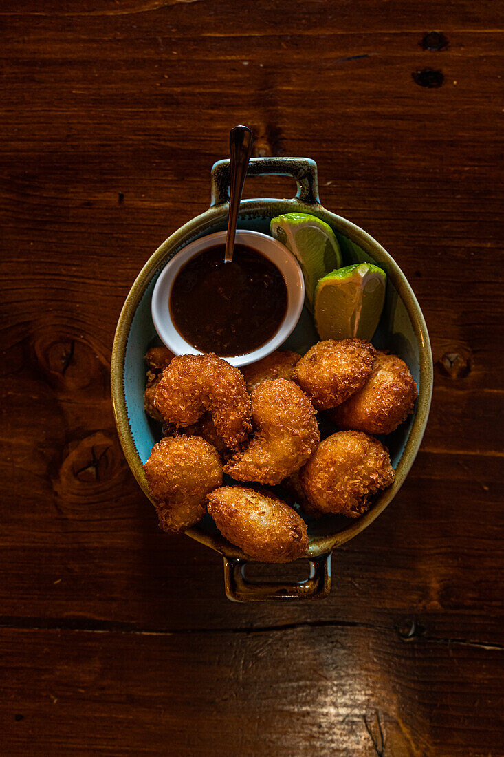 Bang bang Shrimp or butter fried crispy shrimp with fresh lime and berry sauce appetizer in the bowl