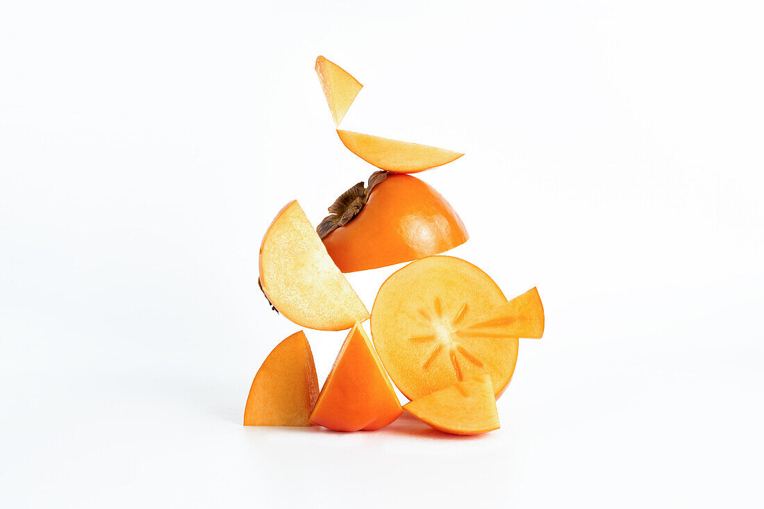 Fresh bio persimmon fruit with a minimalist white background