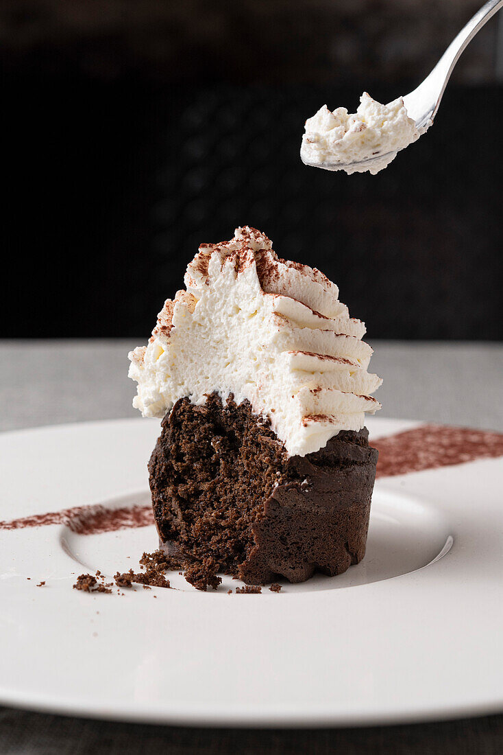 Chocolate carob cupcake with whipped cream