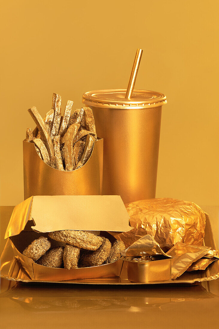 Golden street food placed on a table against a golden background