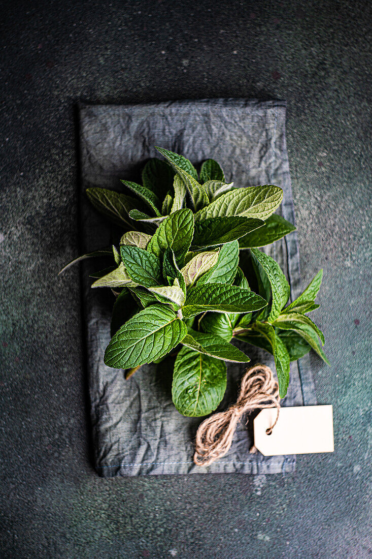 Fresh organic mint leaves ready for cooking on the kitchen table