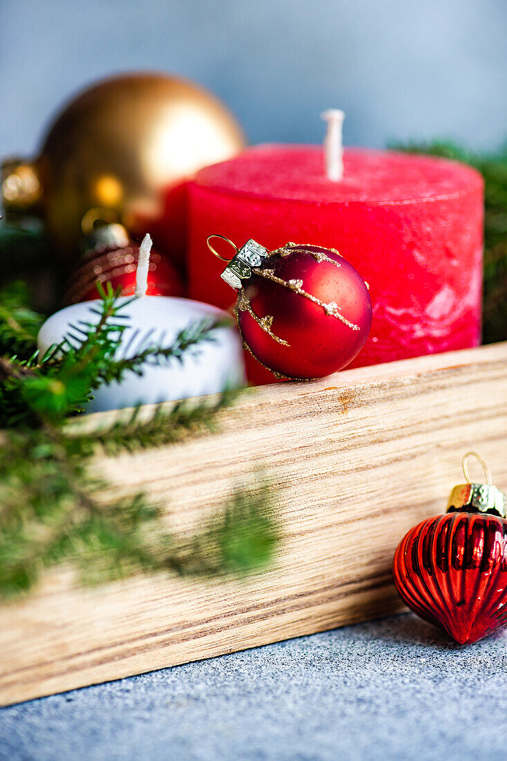 Holiday interion set with candles and fresh fir tree branches