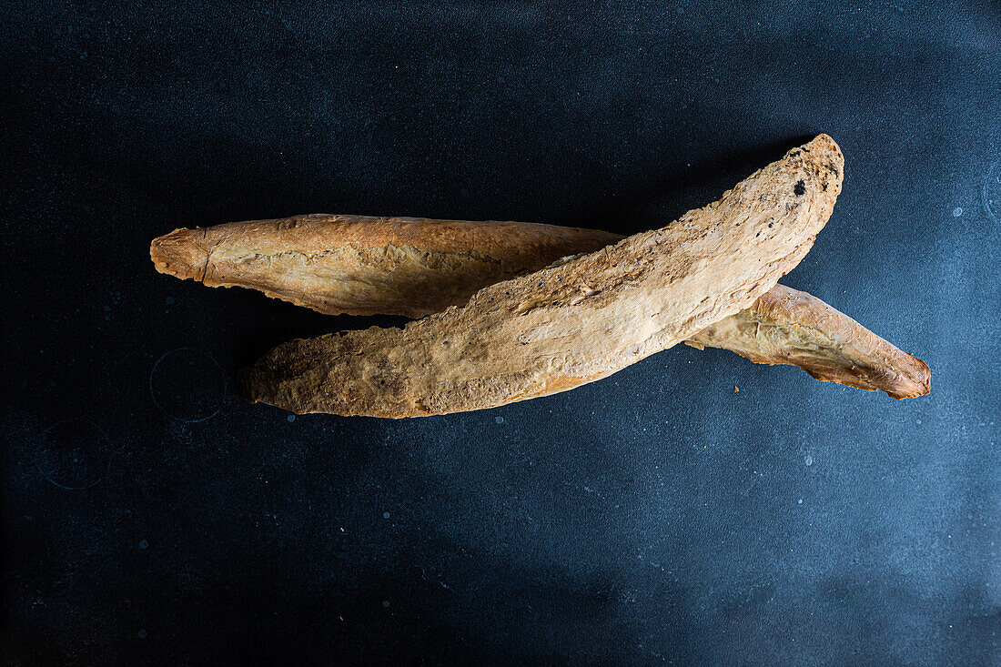 Traditional Georgian bread known as a tonis puri on concrete table