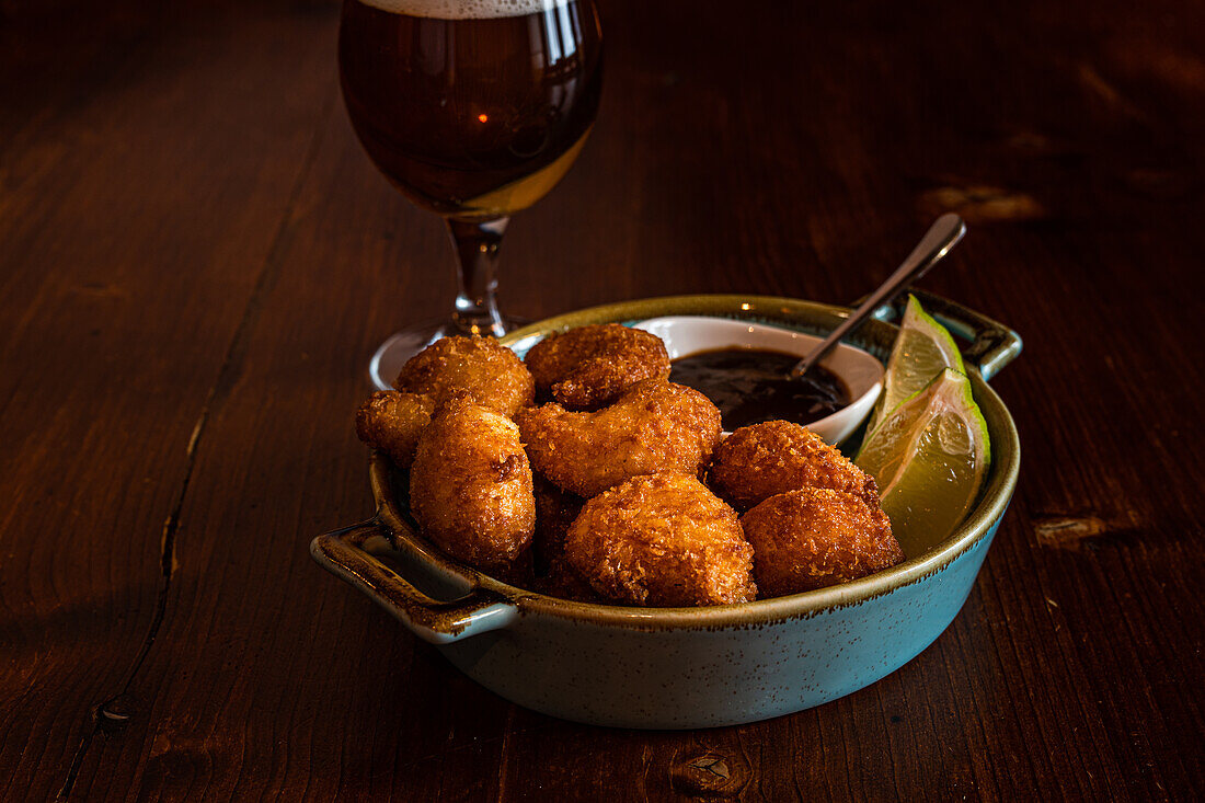 Bang bang Shrimp or butter fried crispy shrimp with fresh lime and berry sauce appetizer in the bowl