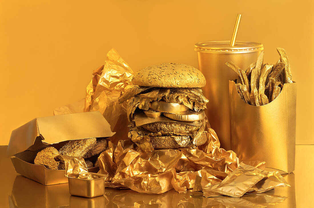 Golden street food placed on a table against a golden background