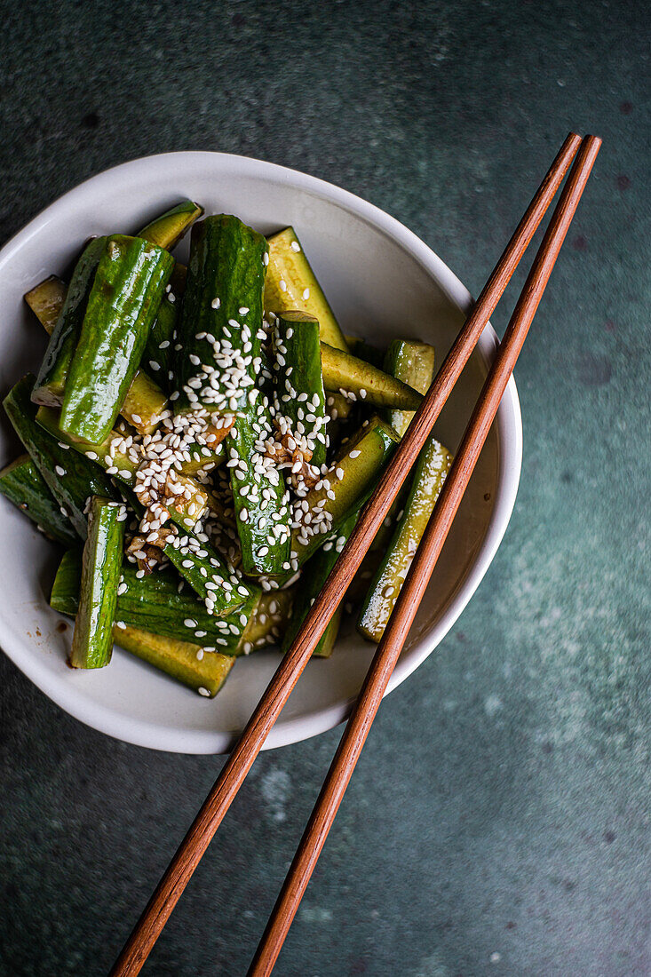 Asian spicy cucumber salad with soy sauce and sesame seeds