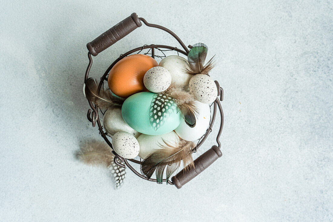 From above basket with easter card concept with eggs on concrete background