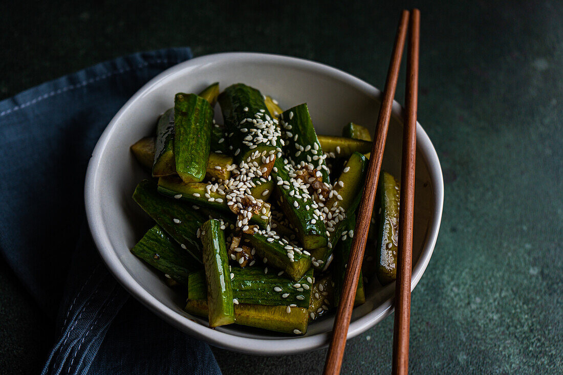 Asian spicy cucumber salad with soy sauce and sesame seeds
