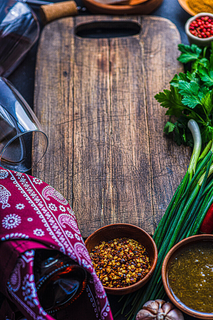 Traditional Georgian food concept with spices, sauces and wines on dark concrete table