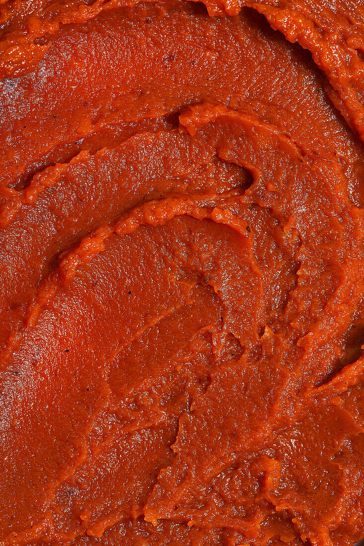 Top view appetizing fresh pumpkin Butter served on concrete table placed