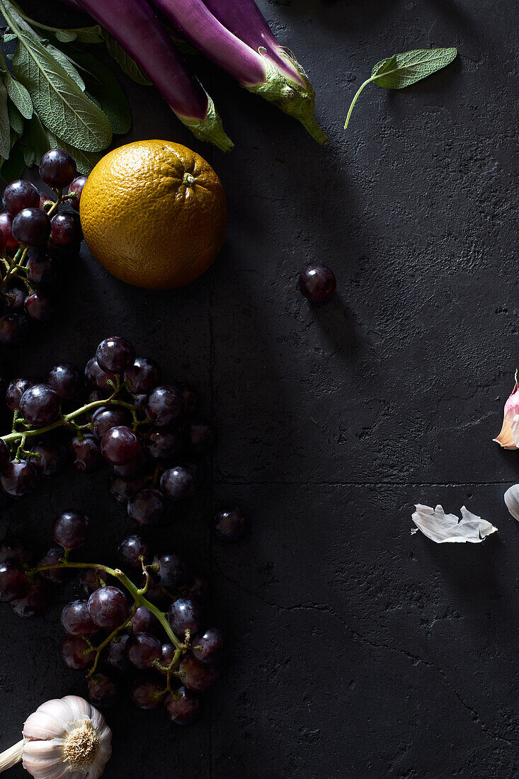 Food concept, flat lay with fresh fruits and vegetables on dark background