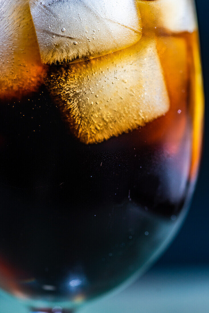 Alcohol cocktail Cuba Libre with ice in the glass