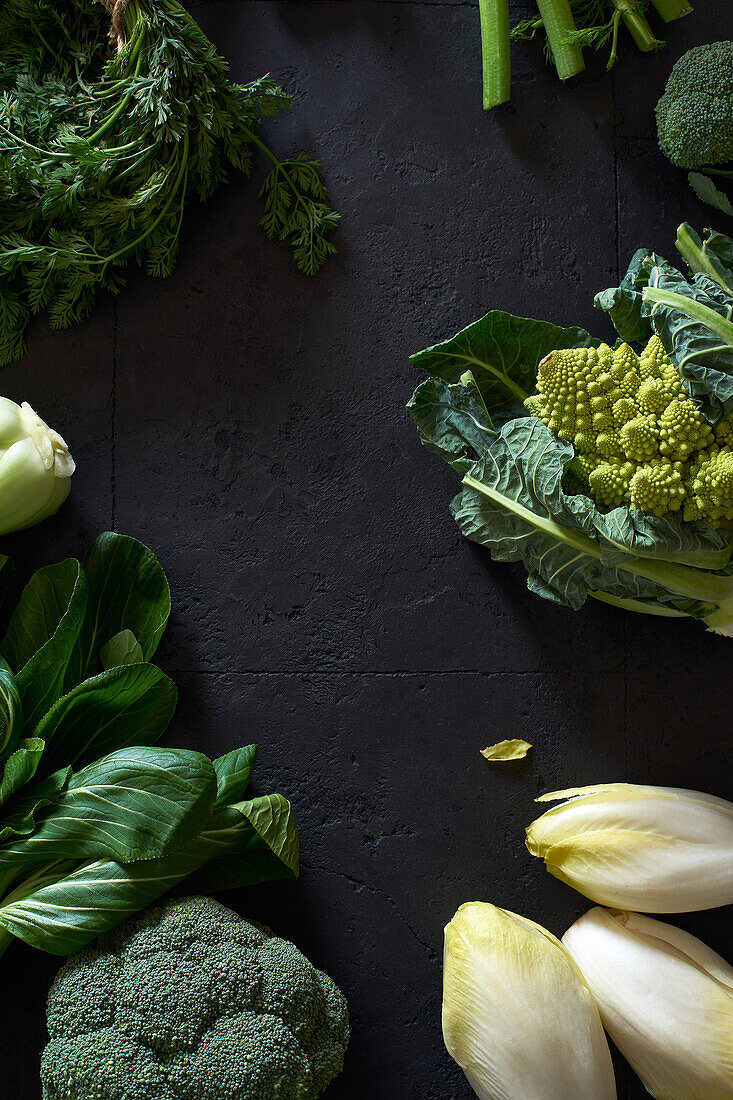 Food concept, flat lay with fresh fruits and vegetables on dark background