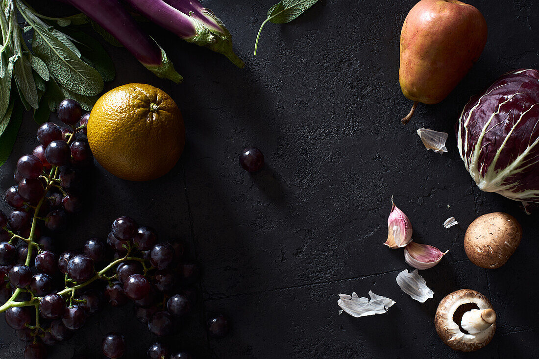 Food concept, flat lay with fresh fruits and vegetables on dark background