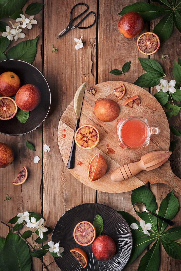 Top view a decorative sanguine fruit and green leaves in a dishes