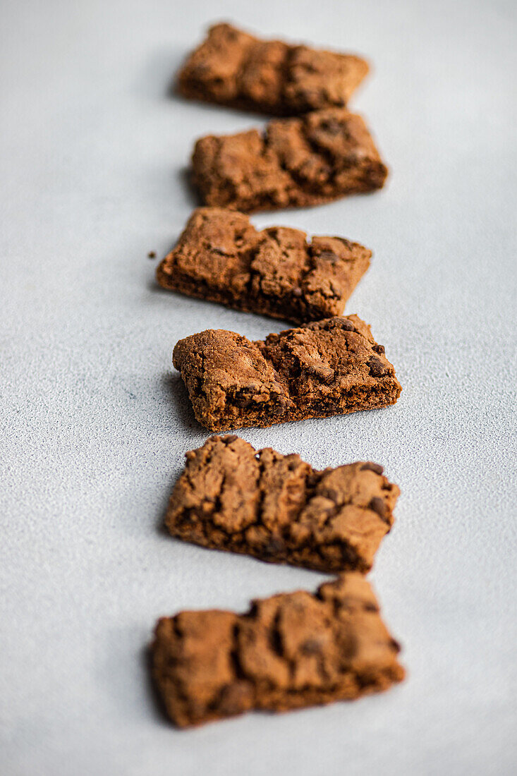 Top view of fresh baked chocolate cookies on concrete background