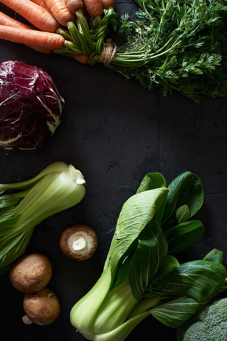 Food concept, flat lay with fresh fruits and vegetables on dark background