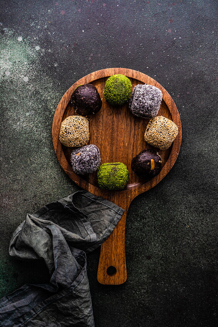 From above traditional turkish sweet pakhlava balls on the wooden cutting board