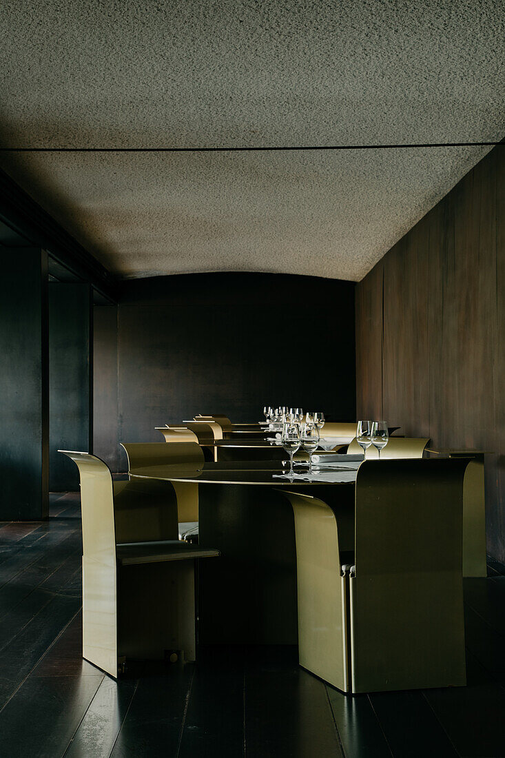 Interior of spacious restaurant with tables and chairs in row in stylish design