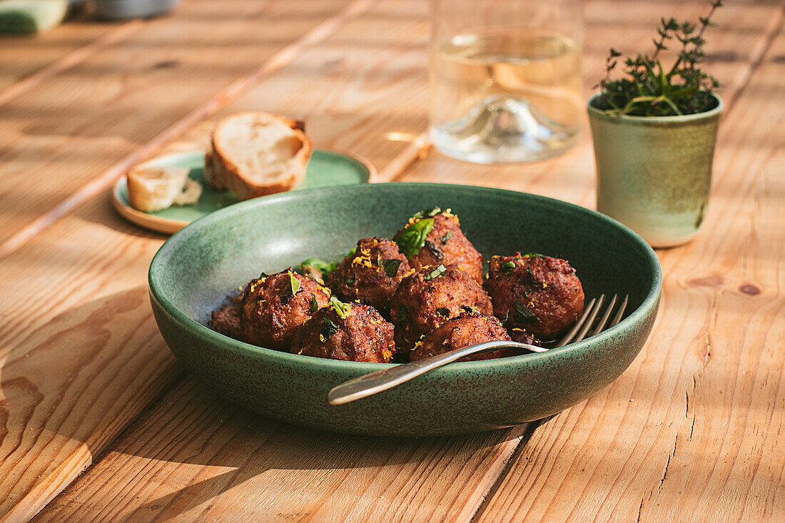 Closeup of a plate of meatloaf with some parsley