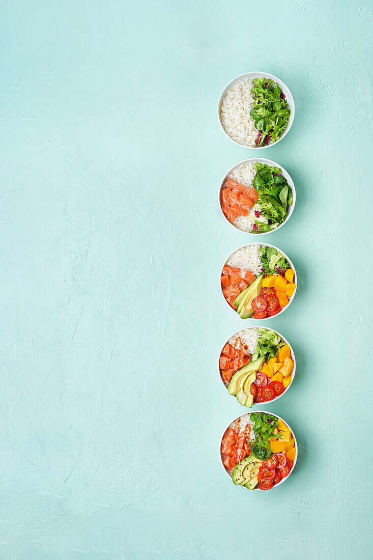 Delicious poke bowl with many ingredients seen from above