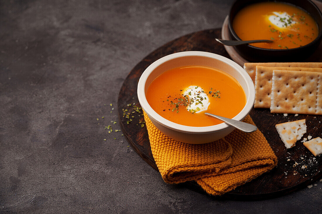 Delicious plates of creamy pumpkin soup seen from above