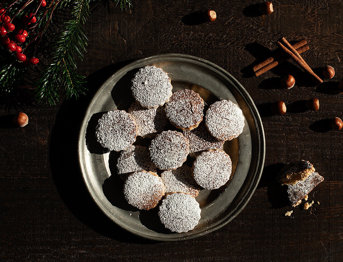 Top view of Christmas hazelnut shortbreads on a wooden table