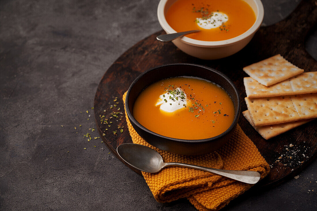 Delicious plates of creamy pumpkin soup seen from above