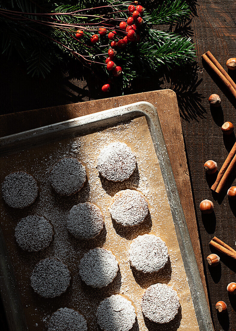 Top view of Christmas hazelnut shortbreads on a wooden table