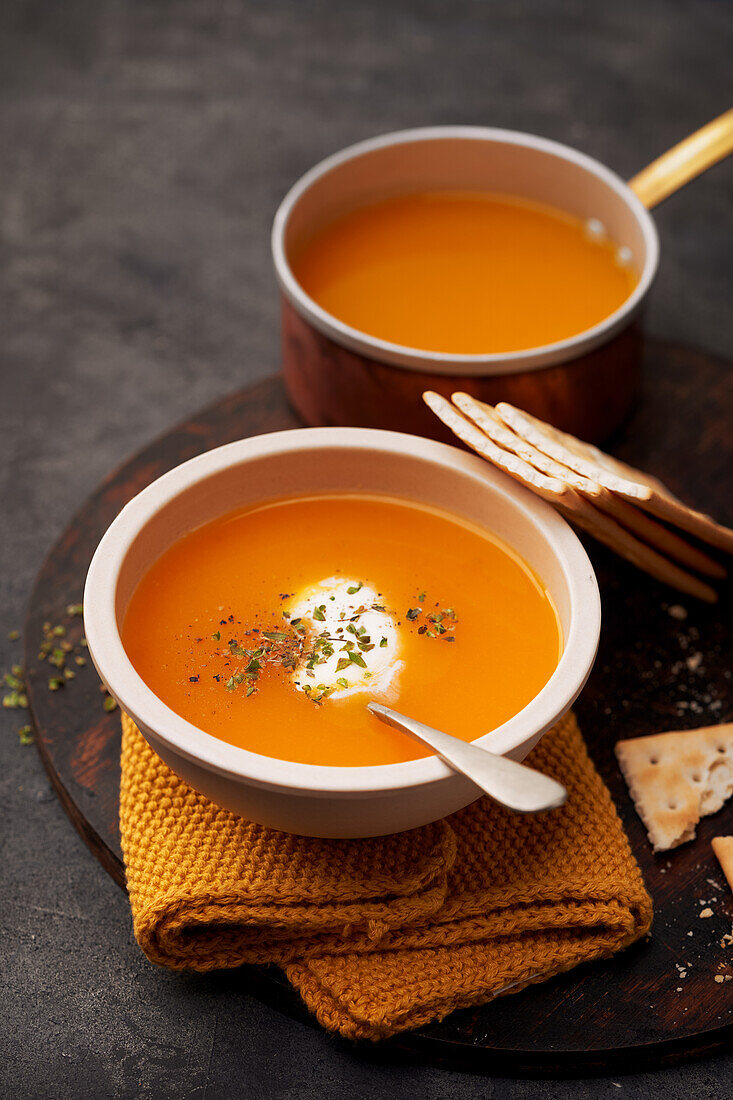 Delicious plates of creamy pumpkin soup seen from above