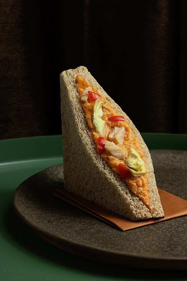 Closeup of a plate with a tuna sandwich