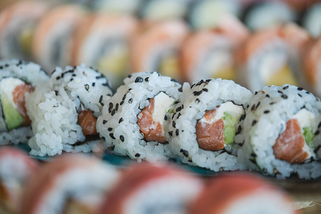 Stock photo of yummy sushi plates in japanese restaurant.