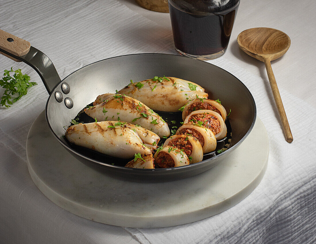 From above fresh tasty stuffed squid served on pan on dinning table