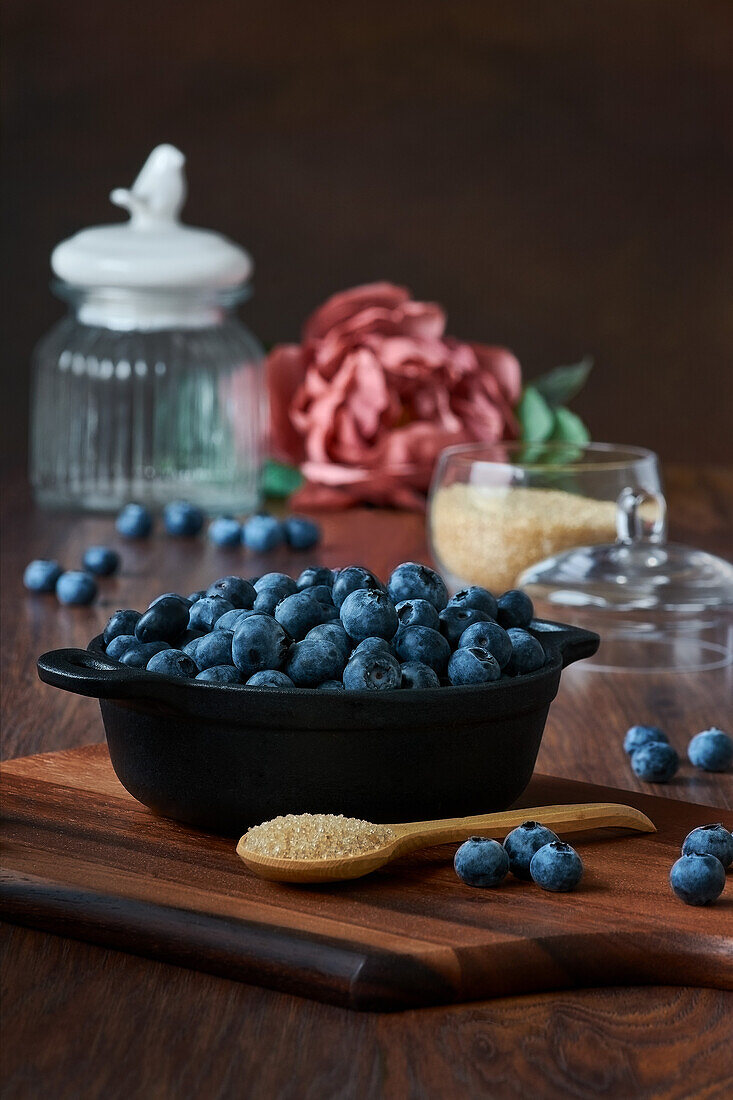 Detail of blueberries in a bowl on the wooden table