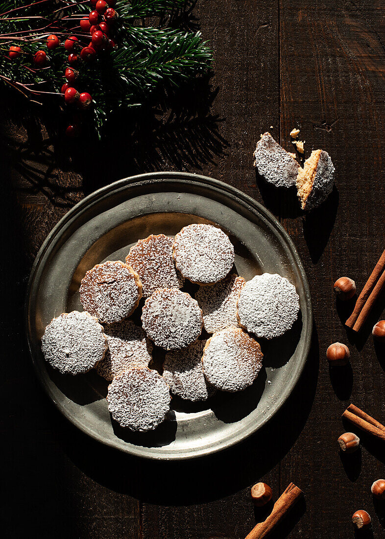 Top view of Christmas hazelnut shortbreads on a wooden table
