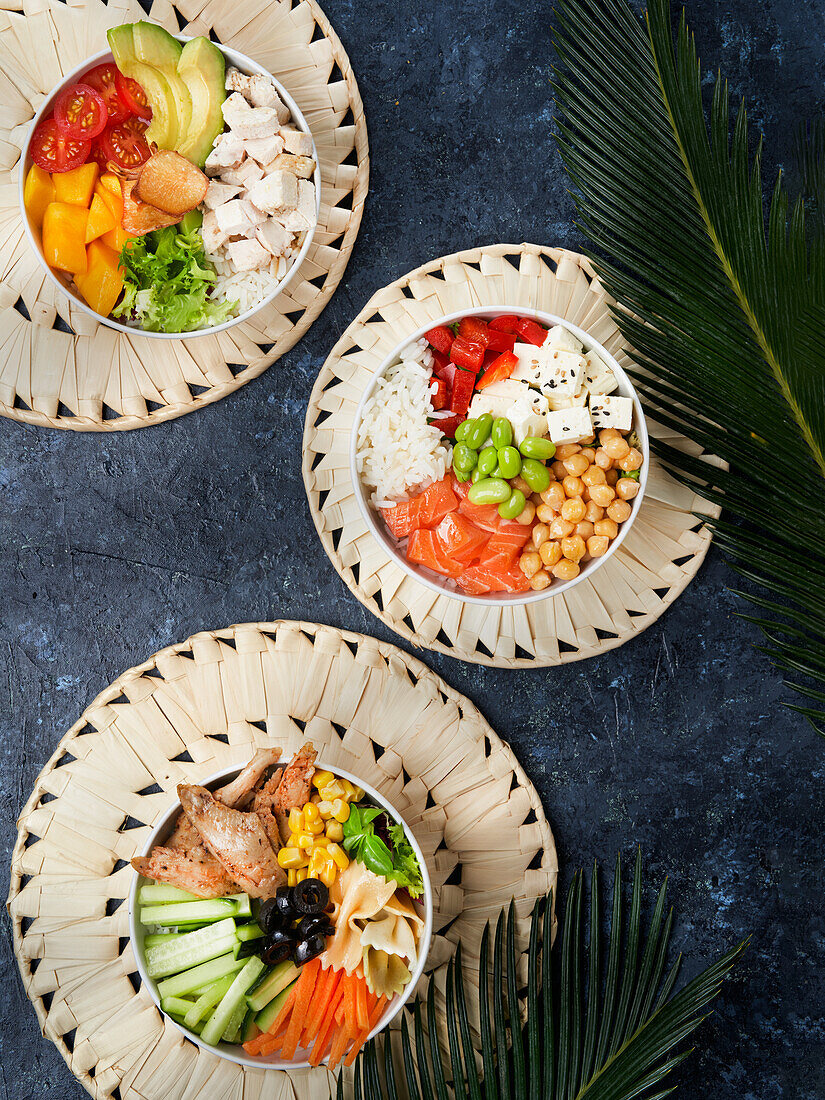 Delicious poke bowl with many ingredients seen from above