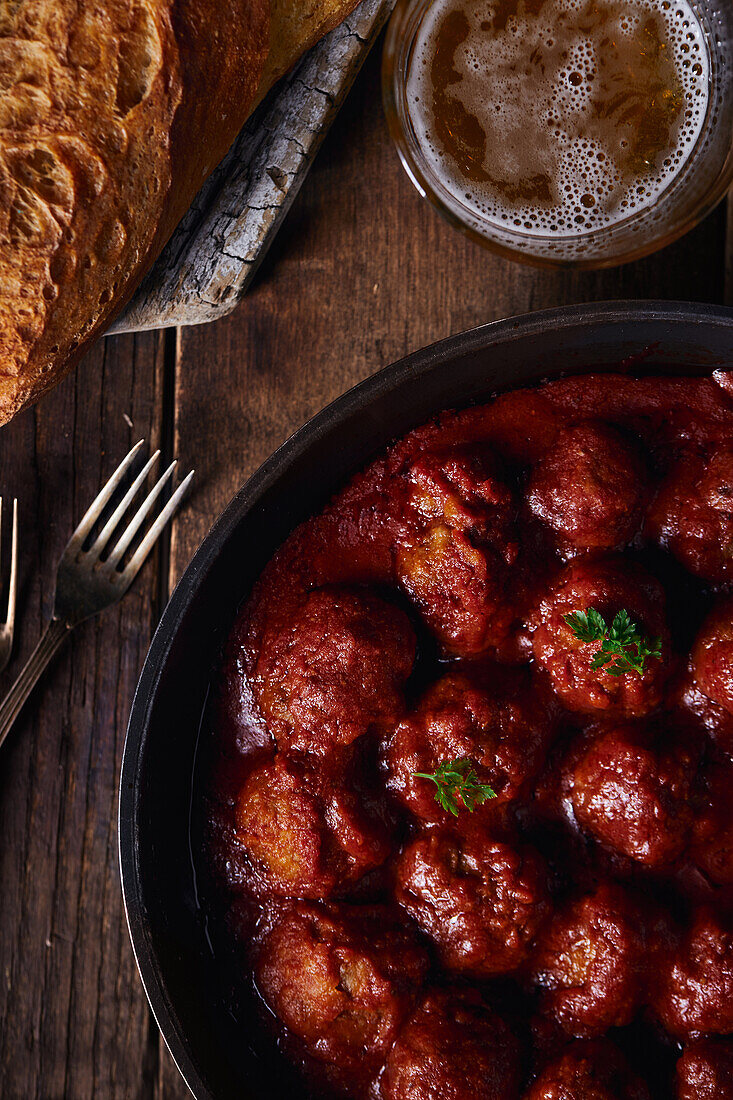 Closeup viewed from above of a plate of meatloaf with tomato