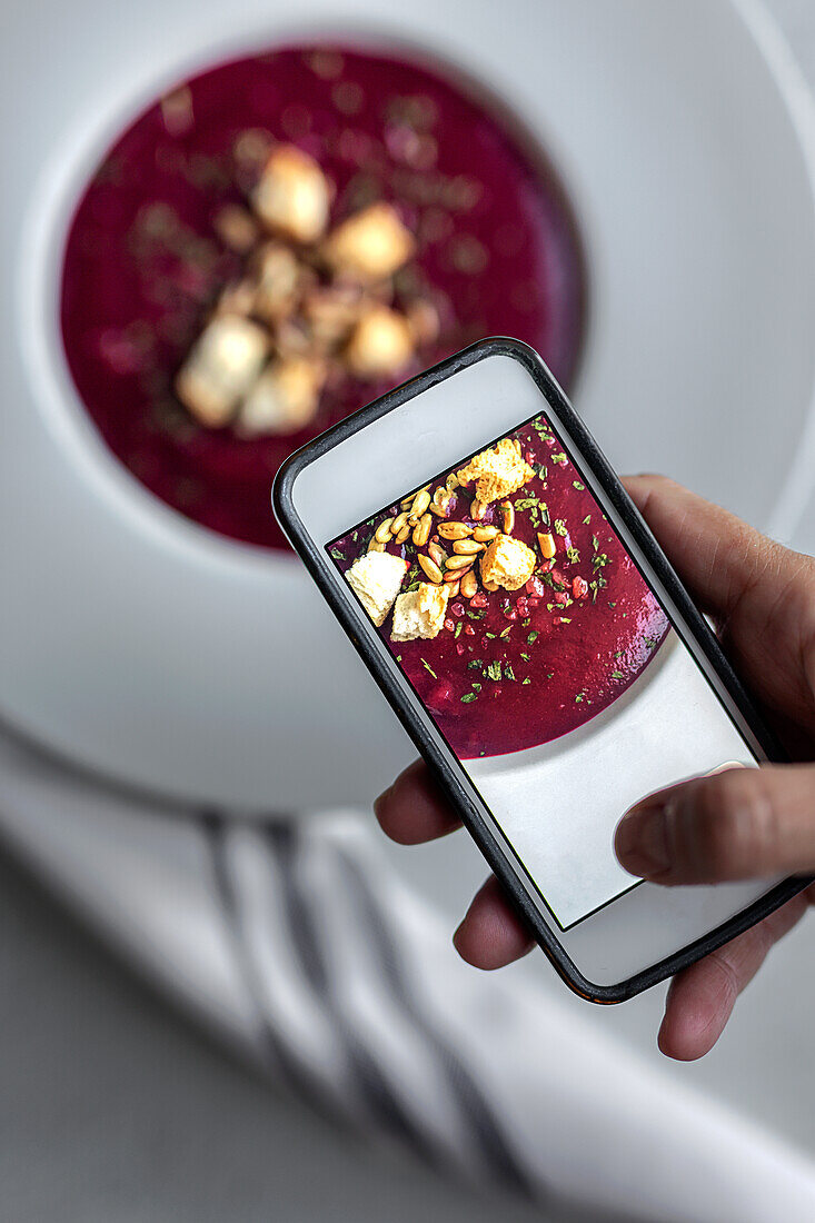 Healthy beet soup. borscht. Flat lay. From above. detox. Photo with the mobile