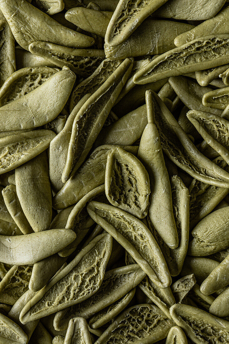 Full frame high angle of fresh green Spinach sfoglia pasta placed on table