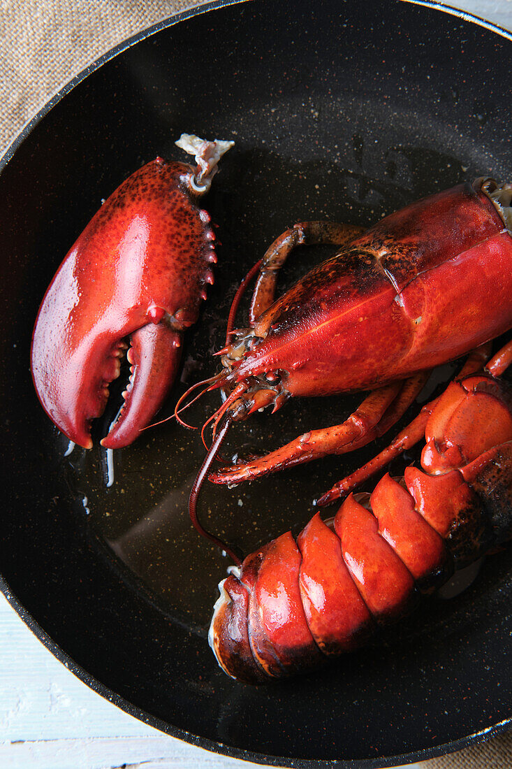Raw lobster in sauce pan prepared for being grilled