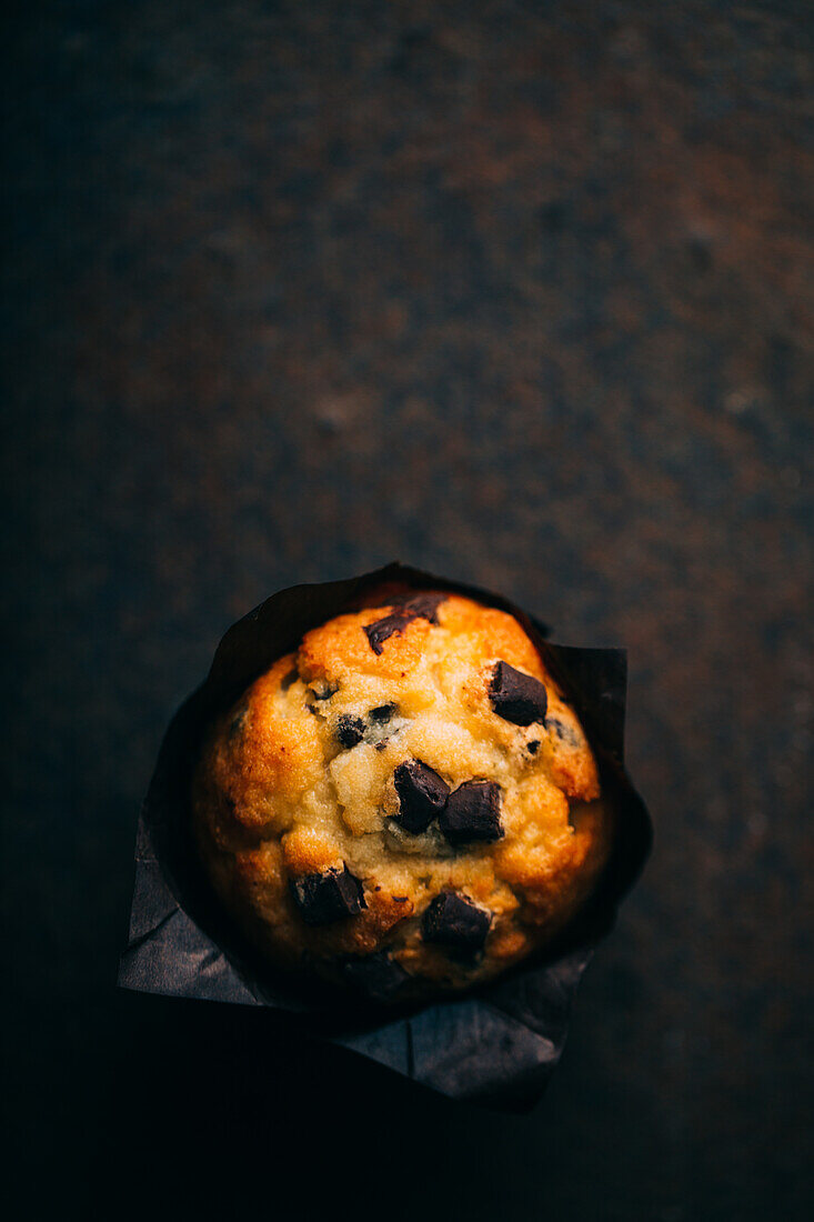 Chocolate muffins on dark background