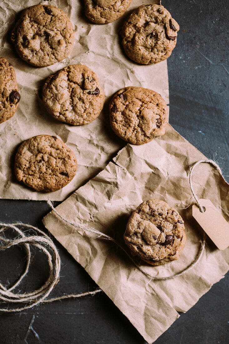 From above homemade chocolate chips cookies on a piece of paper