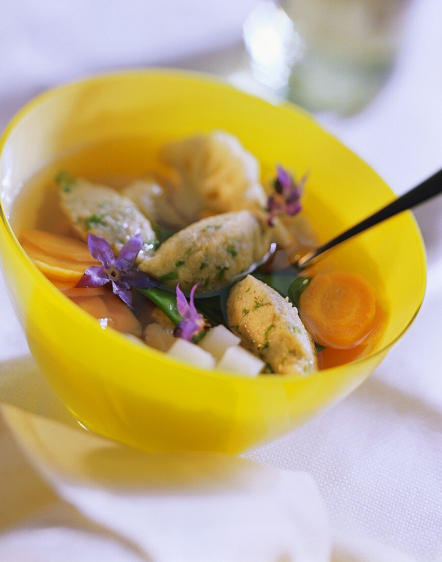 Vegetable soup with herb semolina dumplings