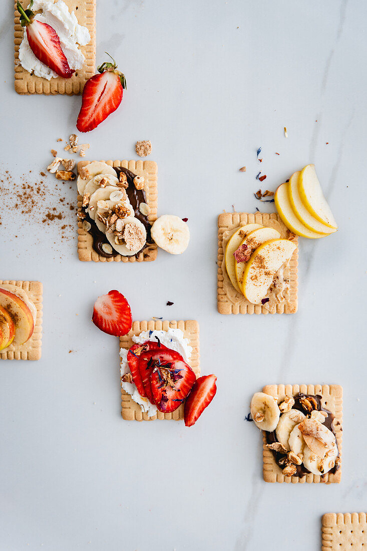 Butter biscuits with chocolate cream, banana, strawberries and cream cheese