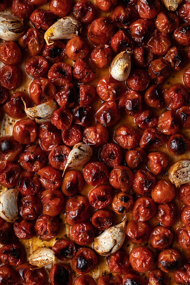 From above of full frame background of delicious casserole with roasted tomatoes and garlic