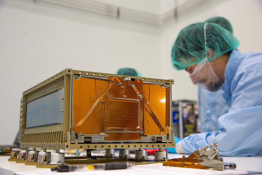 Engineers working on CubeSats for Artemis I