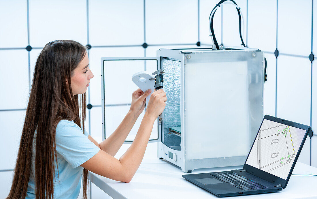 Scientist examining 3D print
