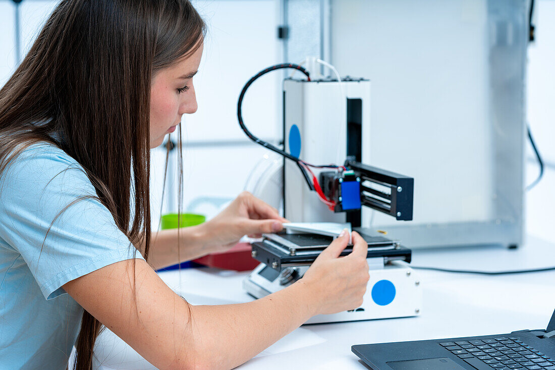 Scientist using 3D printer